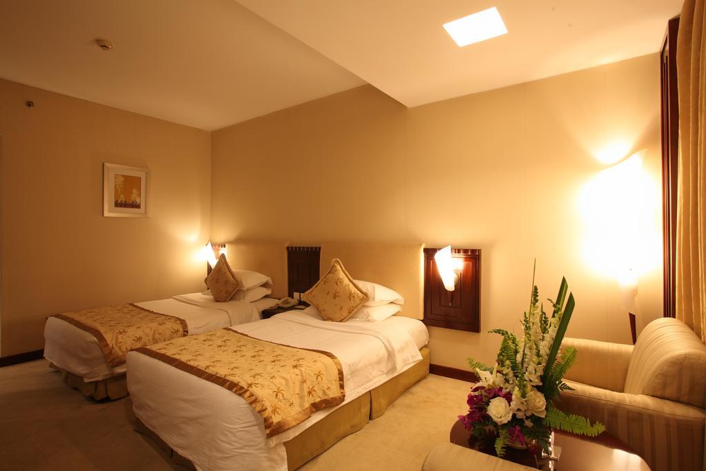 Beijing Wuhuan Hotel Стая снимка