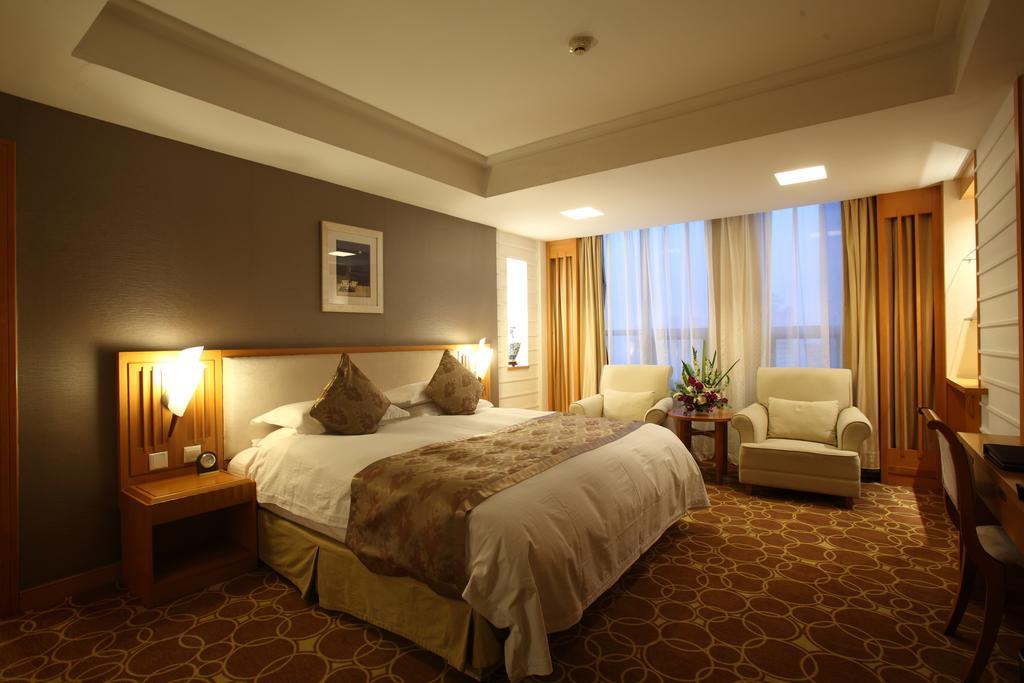 Beijing Wuhuan Hotel Стая снимка