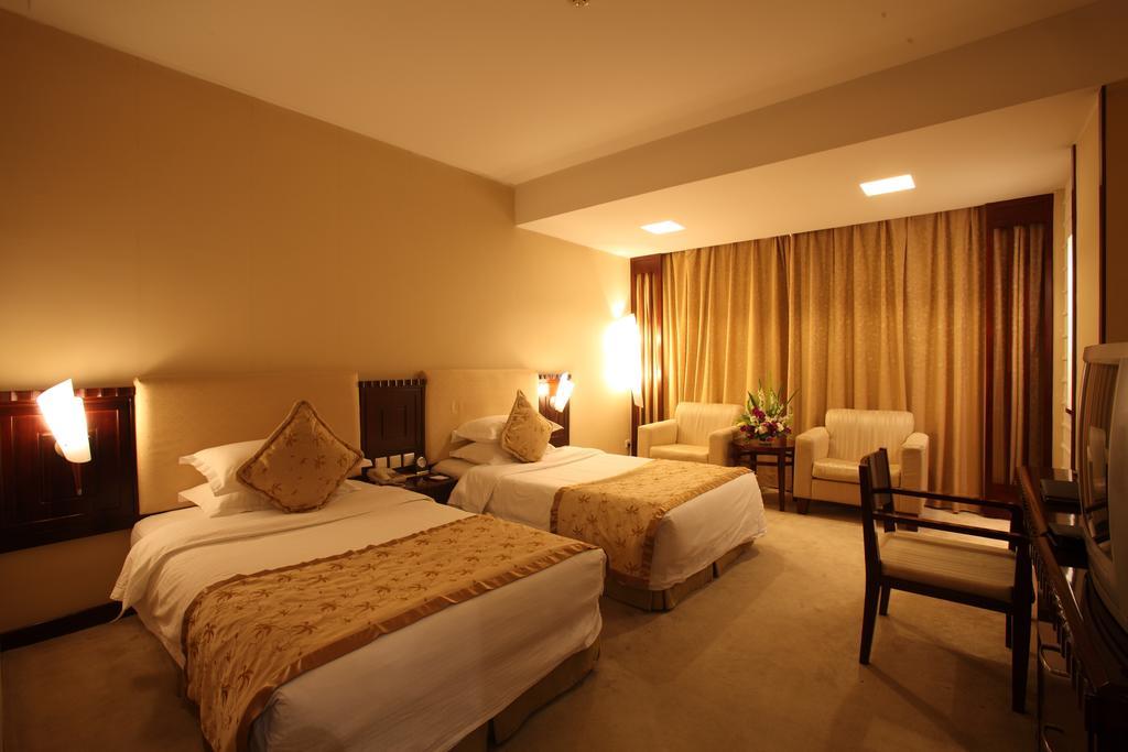 Beijing Wuhuan Hotel Стая снимка