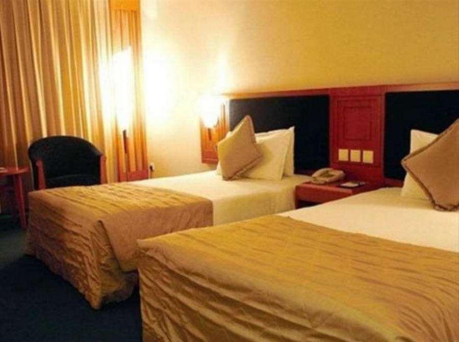 Beijing Wuhuan Hotel Стая снимка