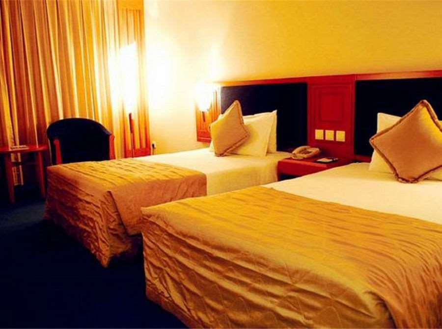 Beijing Wuhuan Hotel Стая снимка