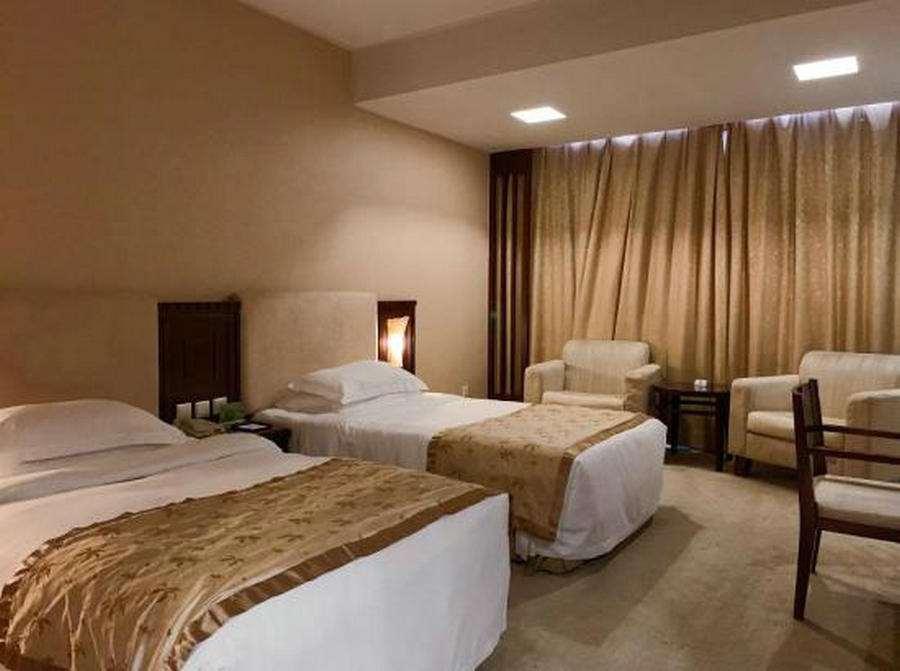 Beijing Wuhuan Hotel Стая снимка
