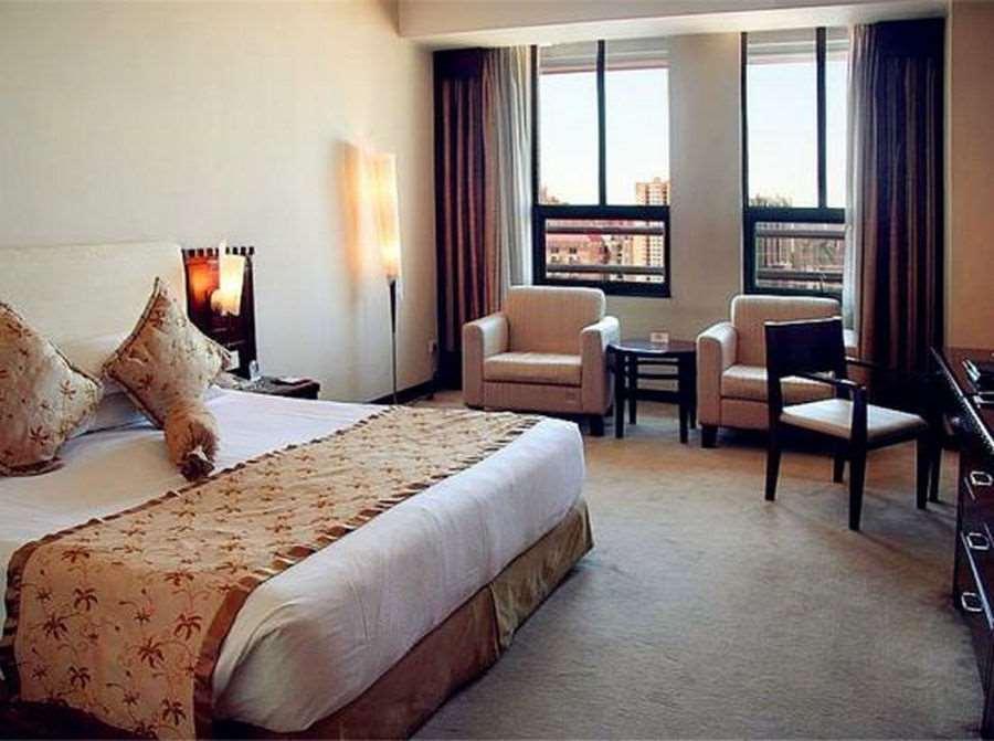 Beijing Wuhuan Hotel Стая снимка